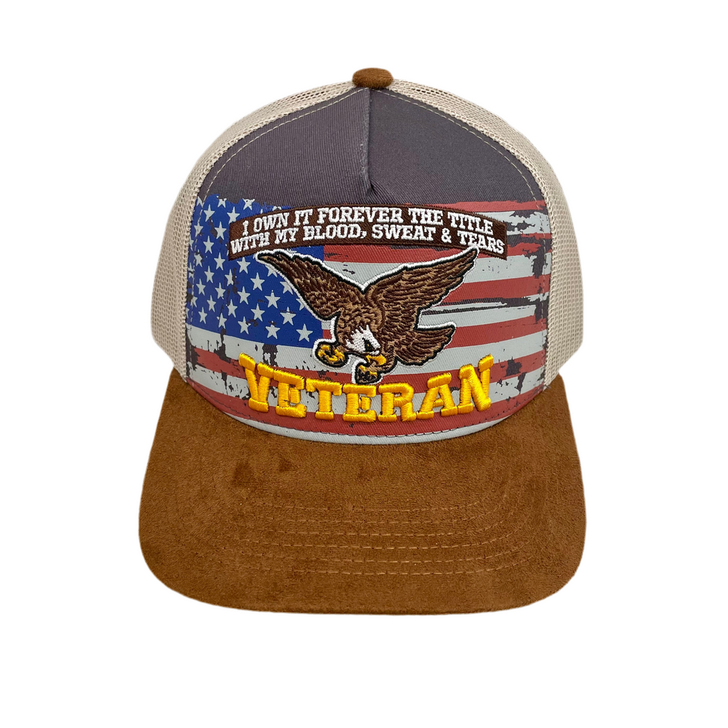 Trucker style baseball cap with  an American flag, eagle, and text on the front saying "I own it forever, the title with my blood, sweat & tears. Veteran"